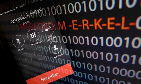 A mobile phone simulating a call to German Chancellor Angela Merkel and computer with a series of numbers is seen in this multiple exposure A mobile phone simulating a call to German Chancellor Angela Merkel and computer with a series of numbers is seen in this multiple exposure