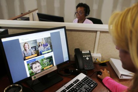 Janet Perez (R) oversees specialists (top) as they help callers and potential customers find health insurance at a customer contact and call Janet Perez (R) oversees specialists (top) as they help callers and potential customers find health insurance at a customer contact and call
