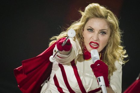 U.S. pop singer Madonna performs during a concert of her MDNA world tour at O2 World in Berlin, June 28, 2012. REUTERS/Thomas Peter U.S. pop singer Madonna performs during a concert of her MDNA world tour at O2 World in Berlin, June 28, 2012. REUTERS/Thomas Peter