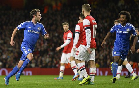 Chelsea's Juan Mata (L) celebrates scoring against Arsenal during their English League Cup fourth round soccer match at Emirates Stadium in Chelsea's Juan Mata (L) celebrates scoring against Arsenal during their English League Cup fourth round soccer match at Emirates Stadium in