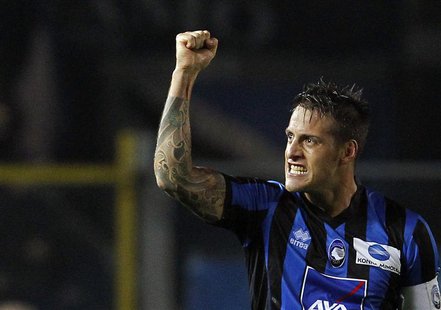Atalanta's German Denis celebrates after scoring against Inter Milan during their Italian Serie A soccer match at Atleti Azzurri d'Italia st Atalanta's German Denis celebrates after scoring against Inter Milan during their Italian Serie A soccer match at Atleti Azzurri d'Italia st