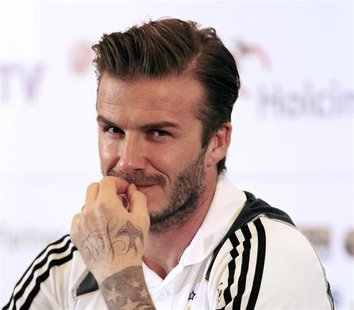 Los Angeles Galaxy's David Beckham reacts during a news confrence in Jakarta November 28, 2011. REUTERS/Beawiharta Los Angeles Galaxy's David Beckham reacts during a news confrence in Jakarta November 28, 2011. REUTERS/Beawiharta