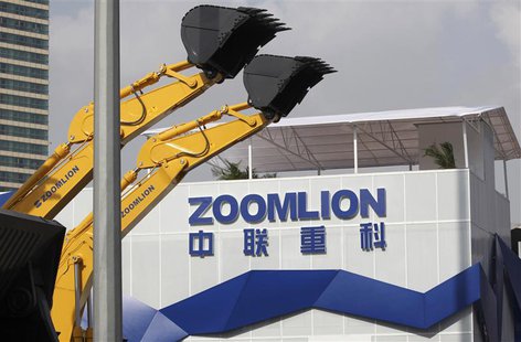 A Zoomlion company logo is seen next to its excavators at an exhibition in Shanghai, in this November 29, 2012 file photo. REUTERS/Stringer/ A Zoomlion company logo is seen next to its excavators at an exhibition in Shanghai, in this November 29, 2012 file photo. REUTERS/Stringer/