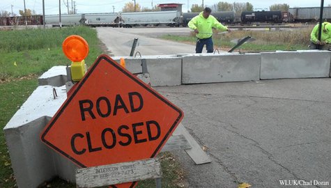 Workers place temporary barricades along a stretch of Lakeshore Dr. in North Fond du Lac, Oct. 29, 2013. The barricades are the first step in closing the road so trains do not need to blow their horns when traveling through the area. (Photo by: FOX 11). Workers place temporary barricades along a stretch of Lakeshore Dr. in North Fond du Lac, Oct. 29, 2013. The barricades are the first step in closing the road so trains do not need to blow their horns when traveling through the area. (Photo by: FOX 11).