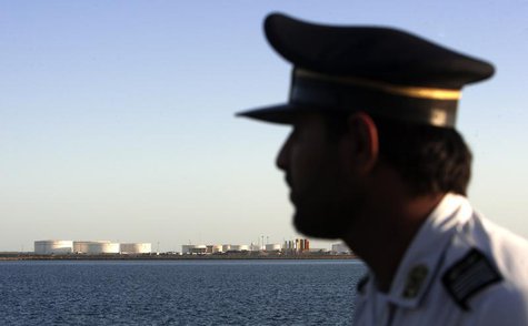 A security personnel looks on at oil docks at the port of Kalantari in the city of Chabahar, 300km (186 miles) east of the Strait of Hormuz A security personnel looks on at oil docks at the port of Kalantari in the city of Chabahar, 300km (186 miles) east of the Strait of Hormuz