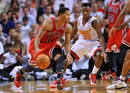 Oct 29, 2013; Miami, FL, USA; Chicago Bulls point guard Derrick Rose (1) is pressured by Miami Heat point guard Norris Cole (30) during the Oct 29, 2013; Miami, FL, USA; Chicago Bulls point guard Derrick Rose (1) is pressured by Miami Heat point guard Norris Cole (30) during the