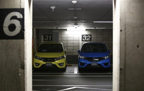 Honda Motor's Fit subcompact hybrid cars are parked in a basement garage at the company's headquarters in Tokyo October 30, 2013. REUTERS/Is Honda Motor's Fit subcompact hybrid cars are parked in a basement garage at the company's headquarters in Tokyo October 30, 2013. REUTERS/Is