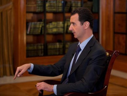 Syria's President Bashar al-Assad speaks during an interview with al-Mayadin television station, in Damascus, in this handout photograph dis Syria's President Bashar al-Assad speaks during an interview with al-Mayadin television station, in Damascus, in this handout photograph dis