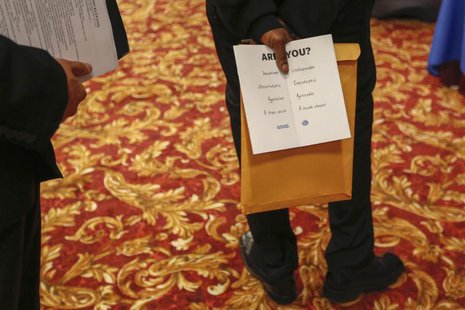 A man holds a pamphlet handed out by a recruiter while attending a job fair in New York, June 11, 2013. REUTERS/Lucas Jackson A man holds a pamphlet handed out by a recruiter while attending a job fair in New York, June 11, 2013. REUTERS/Lucas Jackson