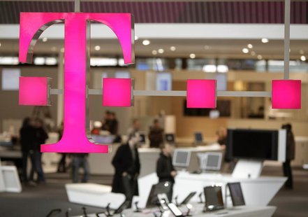 The sign of Deutsche Telekom AG is pictured at its stand for the upcoming CeBIT fair inside a hall in Hanover March 1, 2009. REUTERS/Hanniba The sign of Deutsche Telekom AG is pictured at its stand for the upcoming CeBIT fair inside a hall in Hanover March 1, 2009. REUTERS/Hanniba