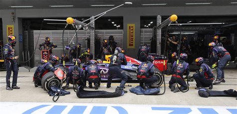 Red Bull Formula One driver Sebastian Vettel of Germany performs a pit stop during the Indian F1 Grand Prix at the Buddh International Circu Red Bull Formula One driver Sebastian Vettel of Germany performs a pit stop during the Indian F1 Grand Prix at the Buddh International Circu
