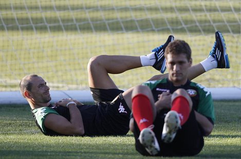 Bulgarian national soccer team players Martin Petrov (L) and Stiliyan Petrov attend a training session in the town of Pravets, some 40km (25 Bulgarian national soccer team players Martin Petrov (L) and Stiliyan Petrov attend a training session in the town of Pravets, some 40km (25