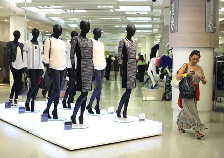 A shopper passes mannequins wearing the new autumn/ winter women's wear collection in Marks & Spencer's in central London on July 25, 2013. A shopper passes mannequins wearing the new autumn/ winter women's wear collection in Marks & Spencer's in central London on July 25, 2013.