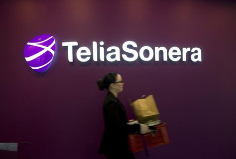 A woman walks past TeliaSonera's logo during the company's fourth quarter result presentation January 31, 2013 in this picture provided by S A woman walks past TeliaSonera's logo during the company's fourth quarter result presentation January 31, 2013 in this picture provided by S