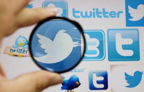 A person holds a magnifying glass over a computer screen displaying Twitter logos, in this picture illustration taken in Skopje September 10 A person holds a magnifying glass over a computer screen displaying Twitter logos, in this picture illustration taken in Skopje September 10