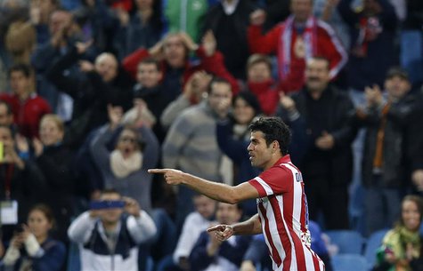 Atletico Madrid's Diego Costa celebrates his goal during their Spanish first division soccer match against Betis at Vicente Calderon stadium Atletico Madrid's Diego Costa celebrates his goal during their Spanish first division soccer match against Betis at Vicente Calderon stadium