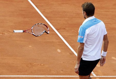 Switzerland's Stanislas Wawrinka throws his racket during his second round match against Brazil's Thomaz Bellucci at the Swiss Open ATP tenn Switzerland's Stanislas Wawrinka throws his racket during his second round match against Brazil's Thomaz Bellucci at the Swiss Open ATP tenn