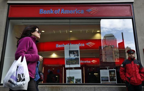 A woman walks past as customers use ATMs at a Bank of America banking center in New York's financial district January 17, 2013. REUTERS/Bren A woman walks past as customers use ATMs at a Bank of America banking center in New York's financial district January 17, 2013. REUTERS/Bren