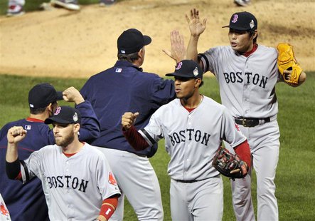 Oct 28, 2013; St. Louis, MO, USA; Boston Red Sox relief pitcher Koji Uehara (right, back) celebrates with Boston Red Sox manager John Farrel Oct 28, 2013; St. Louis, MO, USA; Boston Red Sox relief pitcher Koji Uehara (right, back) celebrates with Boston Red Sox manager John Farrel