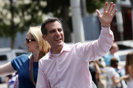 Los Angeles Mayor-elect Eric Garcetti waves to the crowd with his wife Amy Elaine Wakeland during the 43rd annual LA LGBT Pride Parade in We Los Angeles Mayor-elect Eric Garcetti waves to the crowd with his wife Amy Elaine Wakeland during the 43rd annual LA LGBT Pride Parade in We
