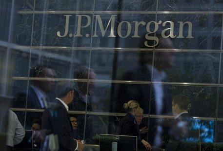 Workers are reflected in the windows of the Canary Wharf offices of JP Morgan in London September 19, 2013. REUTERS/Neil Hall Workers are reflected in the windows of the Canary Wharf offices of JP Morgan in London September 19, 2013. REUTERS/Neil Hall