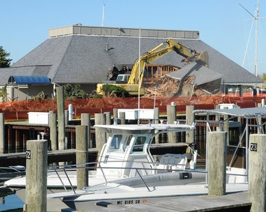 Cranes work on demolishing the 49-year-old Macatawa Bay Yacht Club clubhouse. (photo courtesy Macatawa Bay Yacht Club) Cranes work on demolishing the 49-year-old Macatawa Bay Yacht Club clubhouse. (photo courtesy Macatawa Bay Yacht Club)
