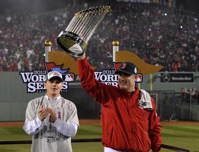 Oct 30, 2013; Boston, MA, USA; Boston Red Sox manager John Farrell hoists the World Series championship trophy after game six of the MLB bas Oct 30, 2013; Boston, MA, USA; Boston Red Sox manager John Farrell hoists the World Series championship trophy after game six of the MLB bas