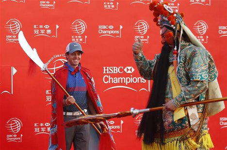 Golfer Rory McIlroy of Northern Ireland attends a photo call for the WGC-HSBC Champions golf tournament on the Bund in Shanghai October 29, Golfer Rory McIlroy of Northern Ireland attends a photo call for the WGC-HSBC Champions golf tournament on the Bund in Shanghai October 29,