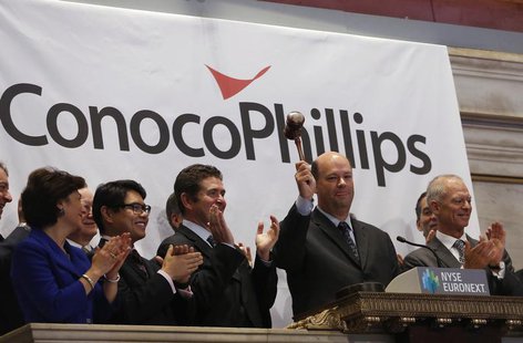 ConocoPhillips Chairman and Chief Executive Officer Ryan M. Lance (2nd R) rings the closing bell at the New York Stock Exchange (NYSE), Febr ConocoPhillips Chairman and Chief Executive Officer Ryan M. Lance (2nd R) rings the closing bell at the New York Stock Exchange (NYSE), Febr
