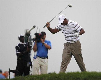Tiger Woods of the U.S. reacts after his tee shot on the sixth hole during the second round of the 92nd PGA Golf Championship at Whistling S Tiger Woods of the U.S. reacts after his tee shot on the sixth hole during the second round of the 92nd PGA Golf Championship at Whistling S