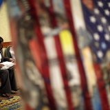 A woman fills out job application forms as she attends a job fair for military veterans and other unemployed people in Los Angeles, Californ A woman fills out job application forms as she attends a job fair for military veterans and other unemployed people in Los Angeles, Californ