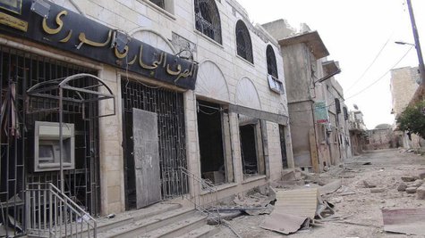 A view of a destroyed Syrian Commercial Bank branch after clashes between the Free Syrian Army and forces loyal to Syria's President Bashar A view of a destroyed Syrian Commercial Bank branch after clashes between the Free Syrian Army and forces loyal to Syria's President Bashar