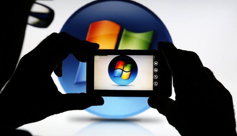A man uses the camera of a Nokia Lumia 820 smartphone as he poses in this photo illustration taken in the central Bosnian town of Zenica, Se A man uses the camera of a Nokia Lumia 820 smartphone as he poses in this photo illustration taken in the central Bosnian town of Zenica, Se