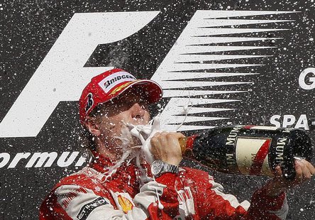 Ferrari GP Formula One driver Kimi Raikkonen of Finland drinks champagne on the podium after winning the Belgian F1 Grand Prix in Spa Franco Ferrari GP Formula One driver Kimi Raikkonen of Finland drinks champagne on the podium after winning the Belgian F1 Grand Prix in Spa Franco