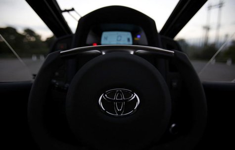 A logo of Toyota is seen on the steering wheel of Toyota's ultra-compact tandem two-seater electric vehicle i-ROAD during the Toyota Advance A logo of Toyota is seen on the steering wheel of Toyota's ultra-compact tandem two-seater electric vehicle i-ROAD during the Toyota Advance