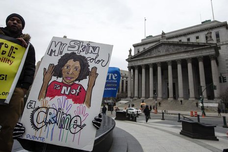Demonstrators hold signs protesting the New York Police Department's "stop and frisk" crime-fighting tactic outside of Manhattan Federal Cou Demonstrators hold signs protesting the New York Police Department's "stop and frisk" crime-fighting tactic outside of Manhattan Federal Cou