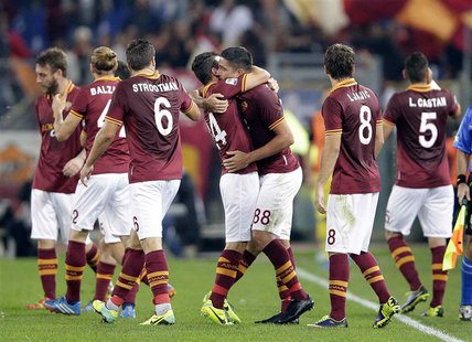 AS Roma's Marco Borriello (3rd R) celebrates with his team mates after scoring against Chievo Verona during their Italian Serie A soccer mat AS Roma's Marco Borriello (3rd R) celebrates with his team mates after scoring against Chievo Verona during their Italian Serie A soccer mat
