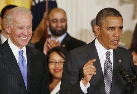 U.S. President Barack Obama (R) speaks about immigration reform next to U.S. Vice President Joe Biden in the East Room at the White House in U.S. President Barack Obama (R) speaks about immigration reform next to U.S. Vice President Joe Biden in the East Room at the White House in