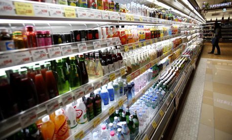 A woman looks at drinks at a supermarket at Ginza shopping district in Tokyo October 31, 2013. REUTERS/Yuya Shino A woman looks at drinks at a supermarket at Ginza shopping district in Tokyo October 31, 2013. REUTERS/Yuya Shino
