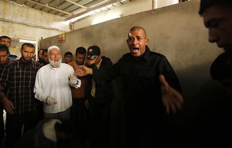 A Palestinian Hamas policeman reacts over the death of Hamas militant Rabee Baraka, at a hospital in Khan Younis in the southern Gaza Strip A Palestinian Hamas policeman reacts over the death of Hamas militant Rabee Baraka, at a hospital in Khan Younis in the southern Gaza Strip