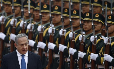 Israel's Prime Minister Benjamin Netanyahu (L) reviews the honour guards during an official welcoming ceremony at the Great Hall of the Peop Israel's Prime Minister Benjamin Netanyahu (L) reviews the honour guards during an official welcoming ceremony at the Great Hall of the Peop