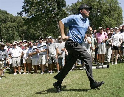 Phil Mickelson of the U.S. runs to look at his shot from the rough at the fifth hole during the first round of the 89th PGA Championship gol Phil Mickelson of the U.S. runs to look at his shot from the rough at the fifth hole during the first round of the 89th PGA Championship gol