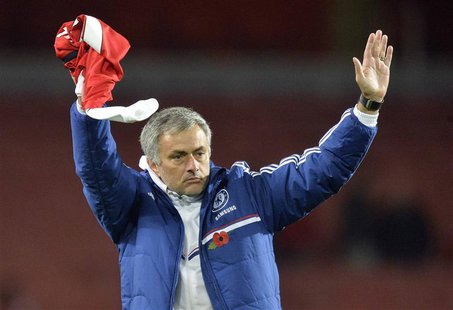 Chelsea's manager Jose Mourinho reacts after their English League Cup fourth round soccer match against Arsenal at Emirates Stadium in Londo Chelsea's manager Jose Mourinho reacts after their English League Cup fourth round soccer match against Arsenal at Emirates Stadium in Londo