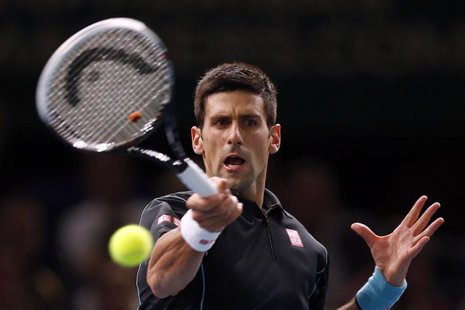 Novak Djokovic of Serbia hits a returns to Pierre-Hugues Herbert of France during their second round men's singles match at the Paris Master Novak Djokovic of Serbia hits a returns to Pierre-Hugues Herbert of France during their second round men's singles match at the Paris Master