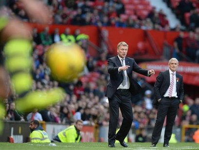 Manchester United's manager David Moyes gestures during their English Premier League soccer match against Stoke City at Old Trafford Stadium Manchester United's manager David Moyes gestures during their English Premier League soccer match against Stoke City at Old Trafford Stadium