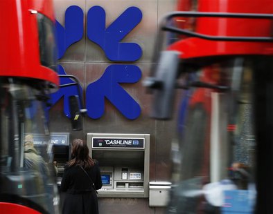 People stand near a branch of Royal Bank of Scotland (RBS) in London November 1, 2013. REUTERS/Luke MacGregor People stand near a branch of Royal Bank of Scotland (RBS) in London November 1, 2013. REUTERS/Luke MacGregor