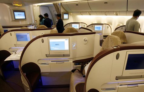 People look at the newly introduced premier class cabin in a Jet Airways Boeing 777-300 ER aircraft during a function at Mumbai airport May People look at the newly introduced premier class cabin in a Jet Airways Boeing 777-300 ER aircraft during a function at Mumbai airport May
