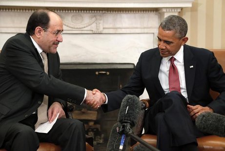 U.S. President Barack Obama (R) shakes hands with Iraq's Prime Minister Nuri al-Maliki (L) after their meeting in the Oval Office at the Whi U.S. President Barack Obama (R) shakes hands with Iraq's Prime Minister Nuri al-Maliki (L) after their meeting in the Oval Office at the Whi