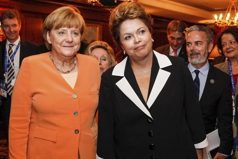 Brazil's President Dilma Rousseff (R) and German Chancellor Angela Merkel pose during a meeting at Santiago, in this photo provided by the B Brazil's President Dilma Rousseff (R) and German Chancellor Angela Merkel pose during a meeting at Santiago, in this photo provided by the B