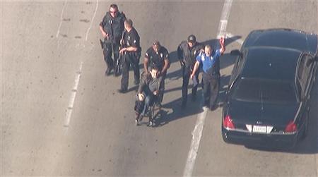 Police escort a man in a wheelchair toward medical help during an incident in which shots were fired at Los Angeles International Airport in Los Angeles in this still image taken from video provided by KNBC November 1, 2013. REUTERS/KNBC/Handout via Reuters Police escort a man in a wheelchair toward medical help during an incident in which shots were fired at Los Angeles International Airport in Los Angeles in this still image taken from video provided by KNBC November 1, 2013. REUTERS/KNBC/Handout via Reuters